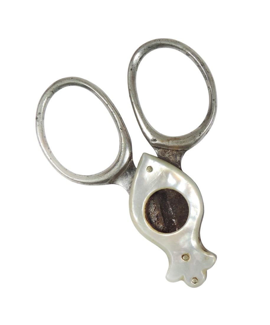 Cigar Cutter, scissor-style cutter featuring two rings for the fingers & sharp blades to slice th...: Cigar Cutter, scissor-style cutter featuring two rings for the fingers & sharp blades to slice the cigar, Mother of Pearl/metal, c. early 1900s, Exc cond, H 2.25 x W 3.25 in (when opened).