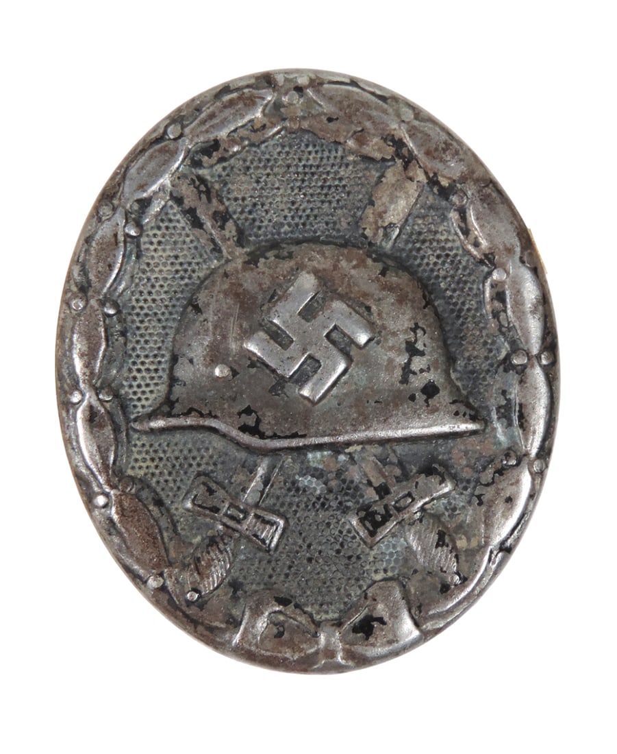 German WWII Wound Badge, Awarded to soldiers wounded in action during WWII, features helmet w/swa... (1 of 1)