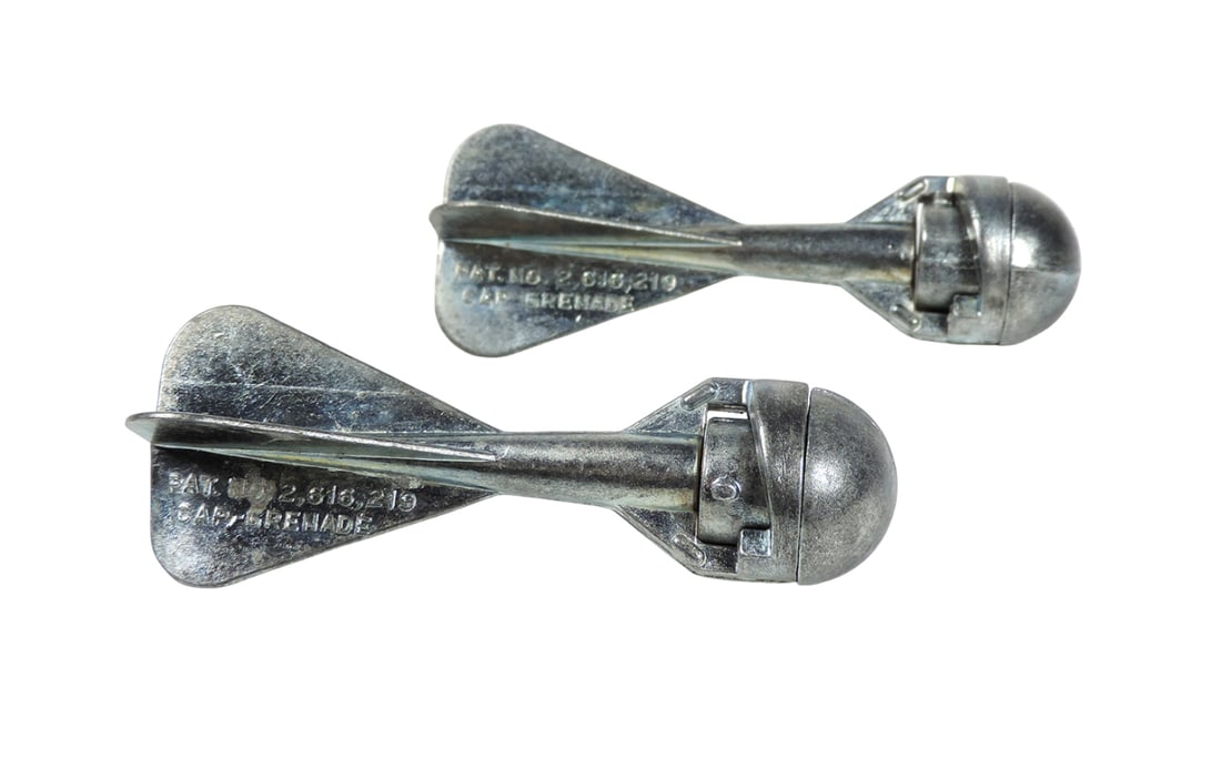 Cap Grenade Throw Toys (2), embossed PAT. NO. 2,616,219 CAP GRENADE, Callen Mfg Corp., Maywood, I...: Cap Grenade Throw Toys (2), embossed PAT. NO. 2,616,219 CAP GRENADE, Callen Mfg Corp., Maywood, Ill, 1 & 4, metal w/working mechanics, c. mid 1900s, Exc cond, H 3 in.