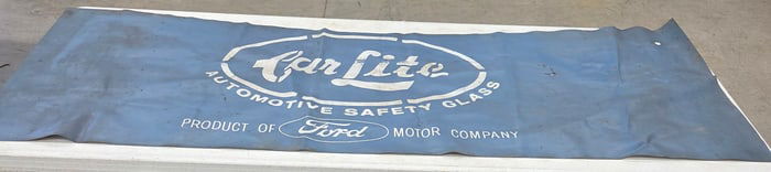 Banner "CAR LIGHT AUTOMOTIVE SAFETY GLASS" . Product of FORD Motor Company. Fair cond. One small