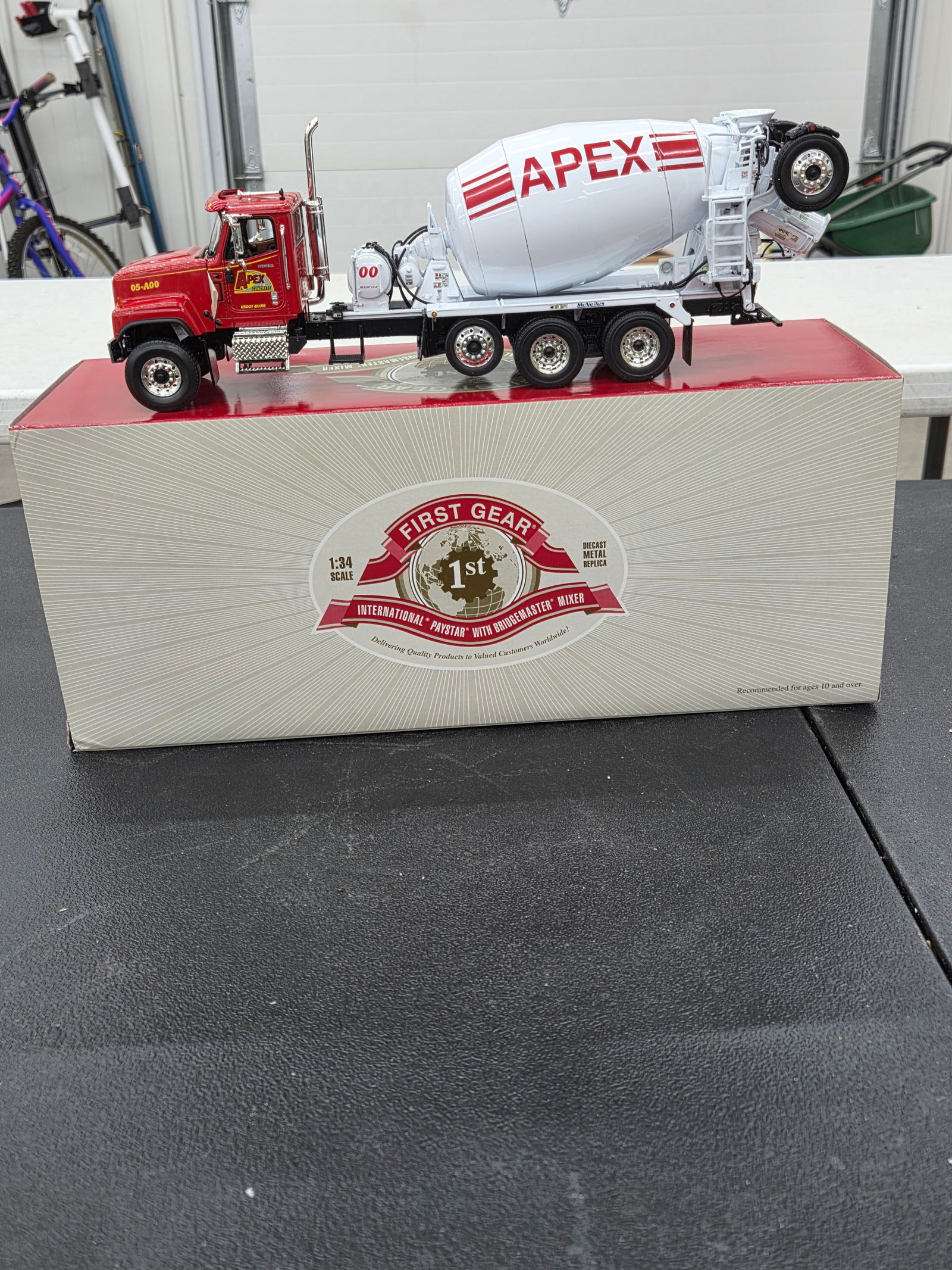 Diecast Toy, International Paystar /w BridgeMaster Mixer (Apex Concrete). First Gear NIB: Diecast Toy, International Paystar /w BridgeMaster Mixer (Apex Concrete). First Gear NIB