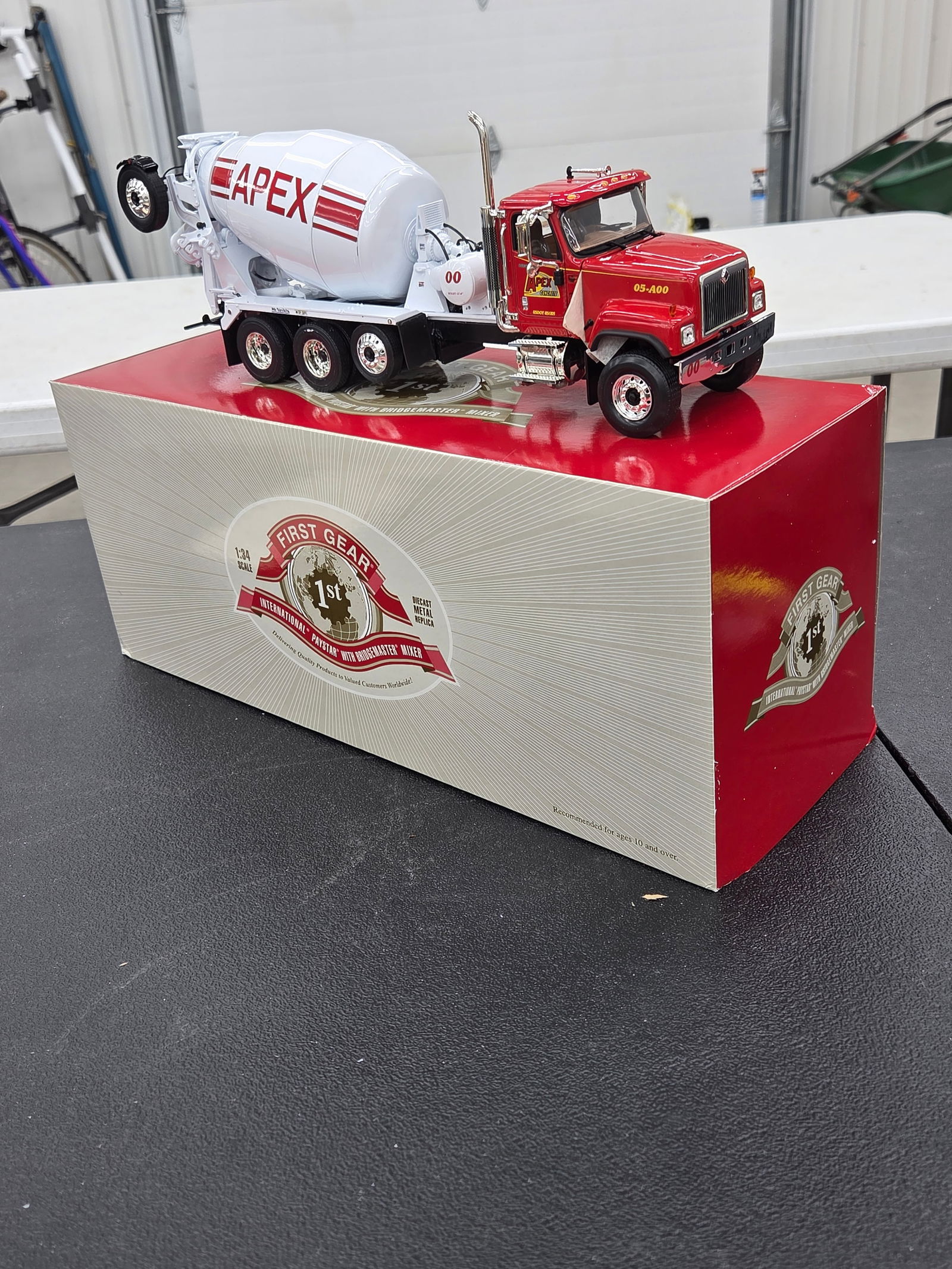 Diecast Toy, International Paystar /w BridgeMaster Mixer (Apex Concrete). First Gear NIB: Diecast Toy, International Paystar /w BridgeMaster Mixer (Apex Concrete). First Gear NIB