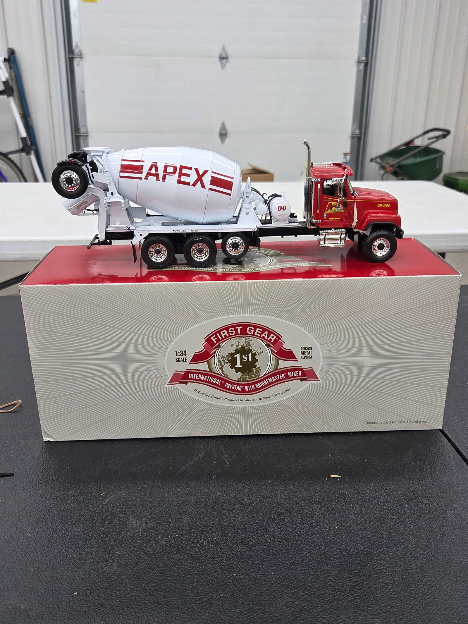 Diecast Toy, International Paystar /w BridgeMaster Mixer (Apex Concrete). First Gear NIB: Diecast Toy, International Paystar /w BridgeMaster Mixer (Apex Concrete). First Gear NIB