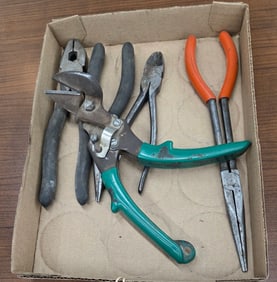 Electrician plies long needle nose, and Tin snips