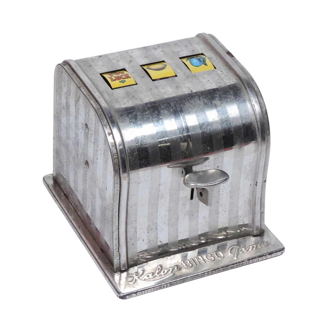 Kalon Bingo Game, engraved Kalon Radio Corp, Brooklyn, N.Y. USA, working mechanisms, metal/paper/...: Kalon Bingo Game, engraved Kalon Radio Corp, Brooklyn, N.Y. USA, working mechanisms, metal/paper/card stock game components, slight tarnish on finish, c. mid 1900s, VG cond, up to H 3.75 x W 4 in.