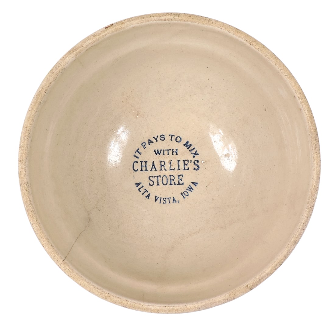 Red Wing Advertising Cap Bowl, blue/rust spongeware ribbed design, stenciled It Pays To Mix With ...: Red Wing Advertising Cap Bowl, blue/rust spongeware ribbed design, stenciled It Pays To Mix With Charlie's Store-Alta Vista, Iowa, old hairline crack visible inside & barely seen on outside, c. early