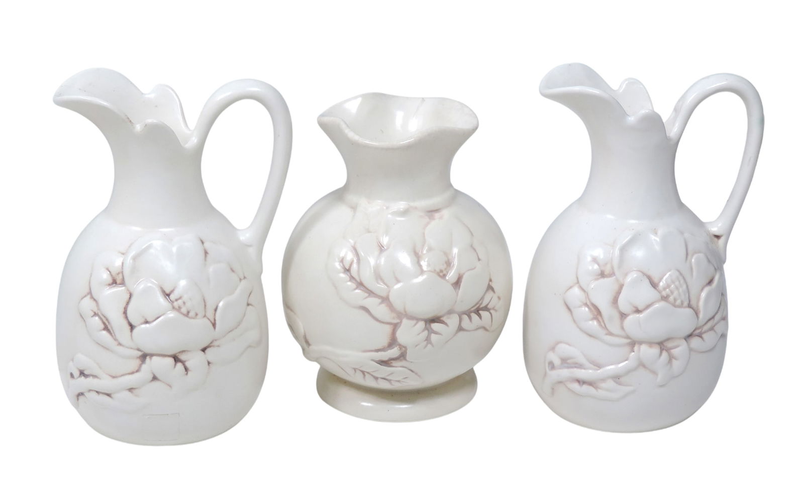 Red Wing Art Pottery (3), #1012 matching pair of Magnolia pitchers & #975 Magnolia vase, all in e...: Red Wing Art Pottery (3), #1012 matching pair of Magnolia pitchers & #975 Magnolia vase, all in eggshell ivory-antiqued in brown, all Exc cond, up to H 7 in. 