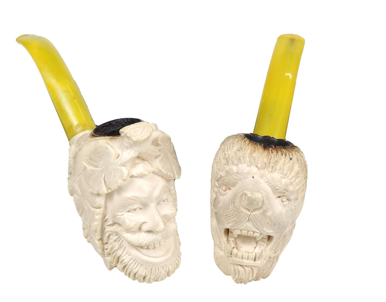 Meerschaum Tobacco Pipes (2), Bust of Bacchus, the Greek God of wine & Lion's Head w/yellow stem,...: Meerschaum Tobacco Pipes (2), Bust of Bacchus, the Greek God of wine & Lion's Head w/yellow stem, small chip on Bacchus top, o/all VG used cond (enlarge photos for details), W 6.5 in.