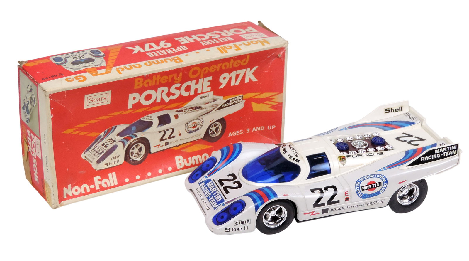 Toy Scale Model, Sears Porsche 917K Battery Operated Non-Fall: Bump and Go, pressed steel/plastic...: Toy Scale Model, Sears Porsche 917K Battery Operated Non-Fall: Bump and Go, pressed steel/plastic, orig packaging, made in Japan, NOS w/age-related wear to packaging (enlarge photos for details), up