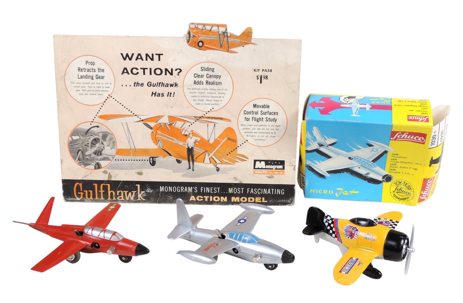 Toy Scale Models/Aviation & Gulfhawk Advertising Display (4), Schuco, silver model, embossed Schuco: Toy Scale Models/Aviation & Gulfhawk Advertising Display (4), Schuco, silver model, embossed Schuco Micro Jet 1030, Thunderjet, no key, orig packaging, red model-embossed Schuco Magister, Micro Jet 10