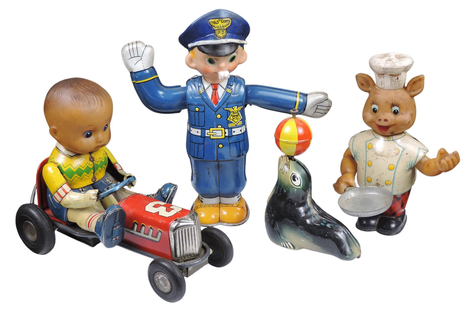 Friction Toys/Windup (4), Traffic Cop, litho on tin w/plastic head windup, made in Japan, Lehmann...: Friction Toys/Windup (4), Traffic Cop, litho on tin w/plastic head windup, made in Japan, Lehmann AHA 910, litho on tin friction performing seal, made in Western Germany, Pippy Cook, litho on tin w/pl