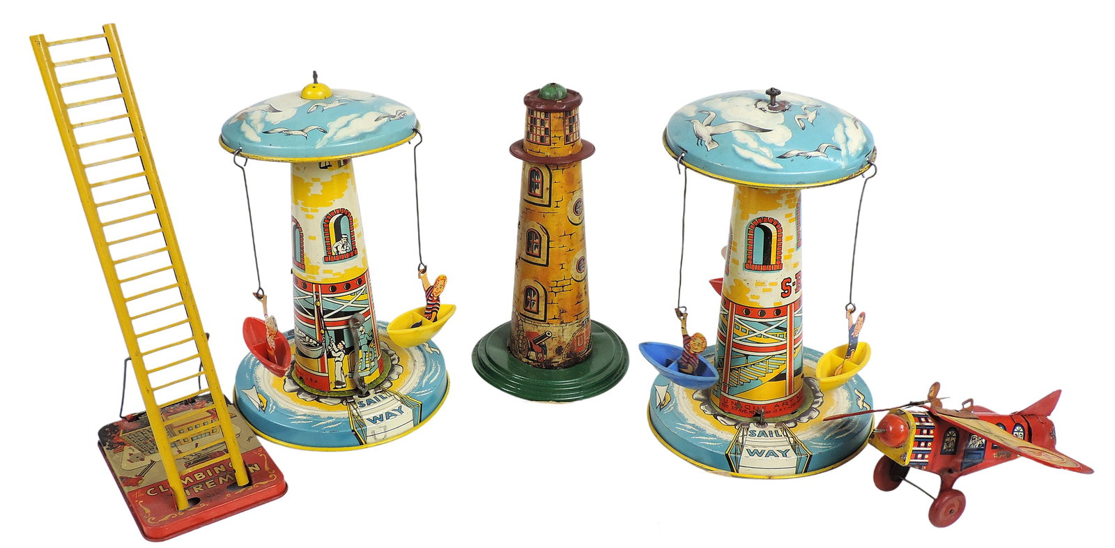 Mechanical Toys & Replacement Parts (5), all litho on tin, Musical Sail Way Lighthouse Carousel (...: Mechanical Toys & Replacement Parts (5), all litho on tin, Musical Sail Way Lighthouse Carousel (2), Marx Keywind Climbing Fireman, Sky Rangers Carousel & Daredevil Flyer, c. early 1900s, Fair cond