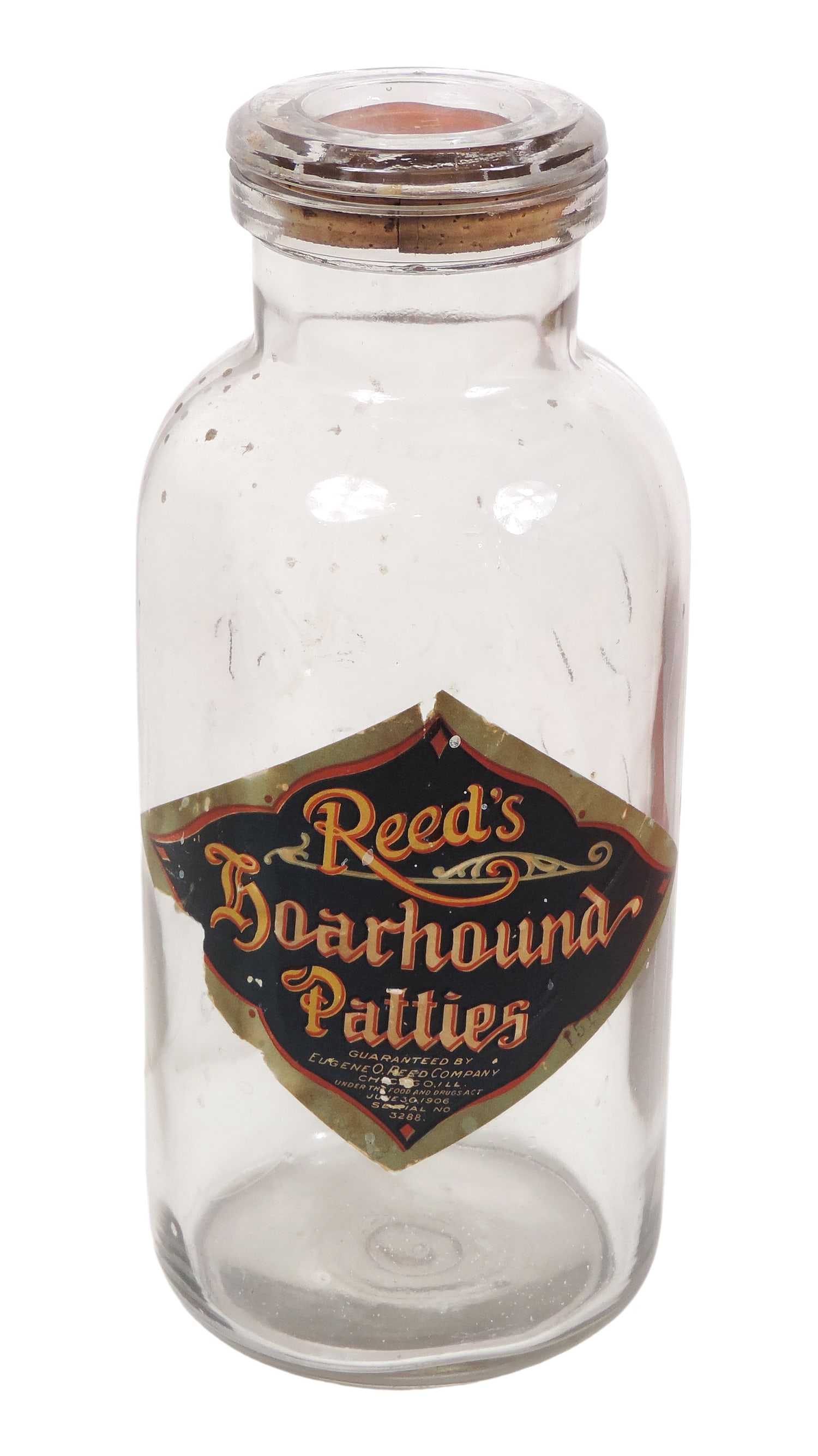 Reed's Hoarhound Patties Glass Container, orig paper label reads Guaranteed by Eugene, O. Reed ...: Reed's Hoarhound Patties Glass Container, orig paper label reads Guaranteed by Eugene, O. Reed Co., Chicago, Ill., Under the Food and Drugs Act June 30, 1906, Serial No. 3288, removable cork/glass lid