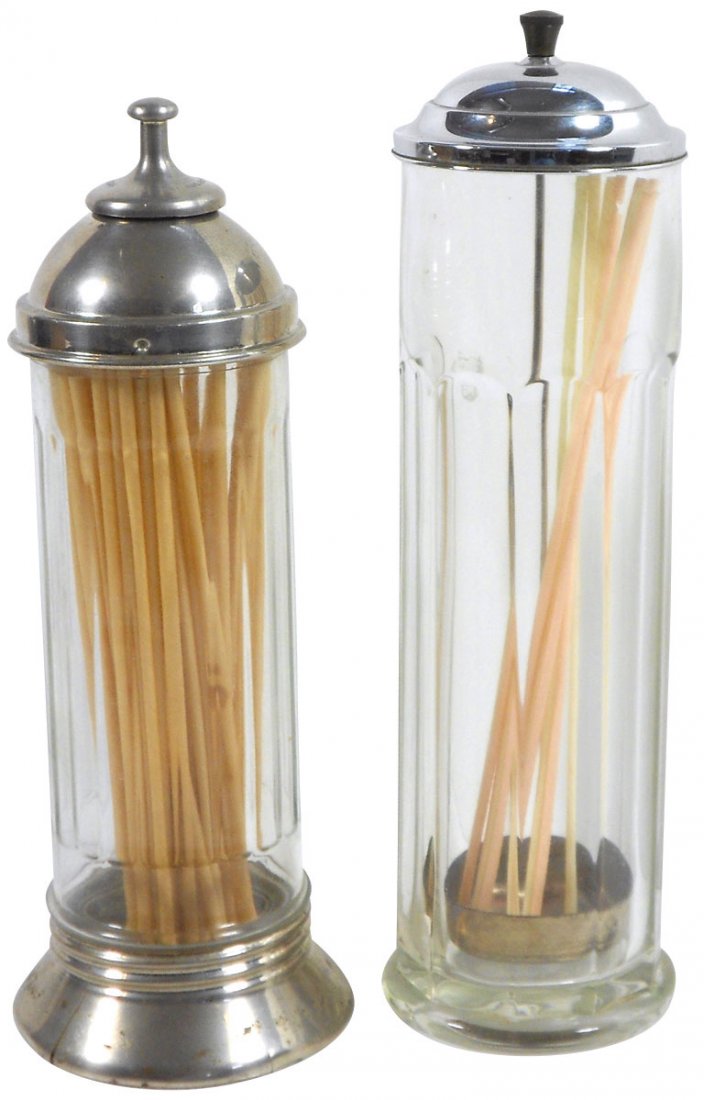 Soda fountain straw holders (2), ribbed clear glass: Soda fountain straw holders (2), ribbed clear glass holder w/metal base & top, dated 1918 w/center dispenser & 10-sided clear glass holder w/metal lid & Bakelite knob, metal based holder has split in