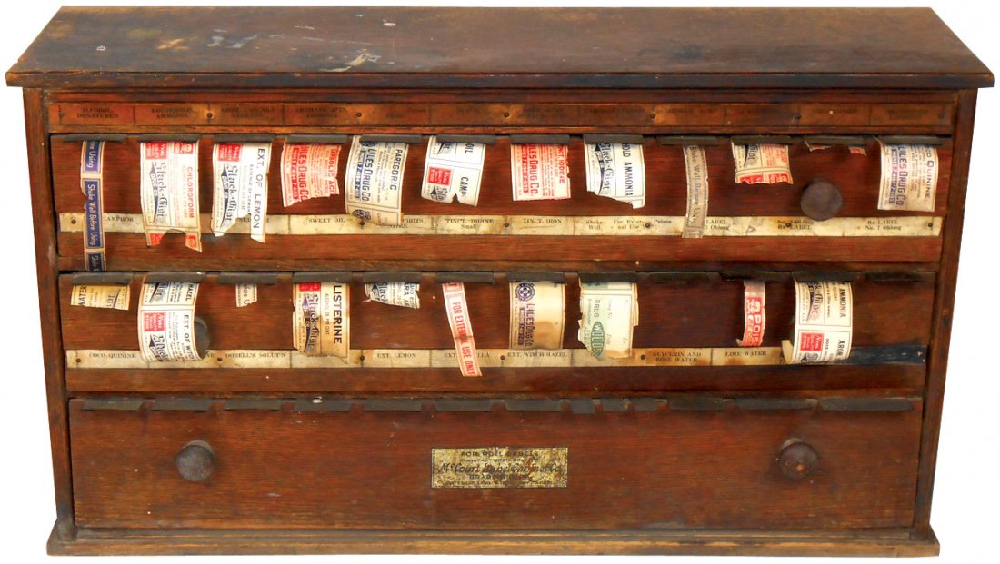 Drug store label cabinet, McCourt oak 3-drwr, 2 drwrs: Drug store label cabinet, McCourt oak 3-drwr, 2 drwrs full of labels from various Birmingham, AL pharmacies, Good/VG cond w/orig surface, 12.5"H x 23"W.