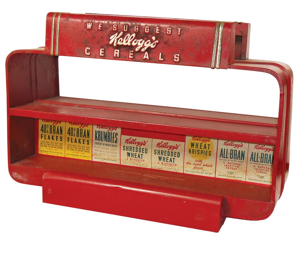 Advertising counter display, Kellogg's Cereal, 2-sided: Advertising counter display, Kellogg's Cereal, 2-sided metal w/shelves for cereal boxes, VG cond, 17"H x 25"W x 12"D.