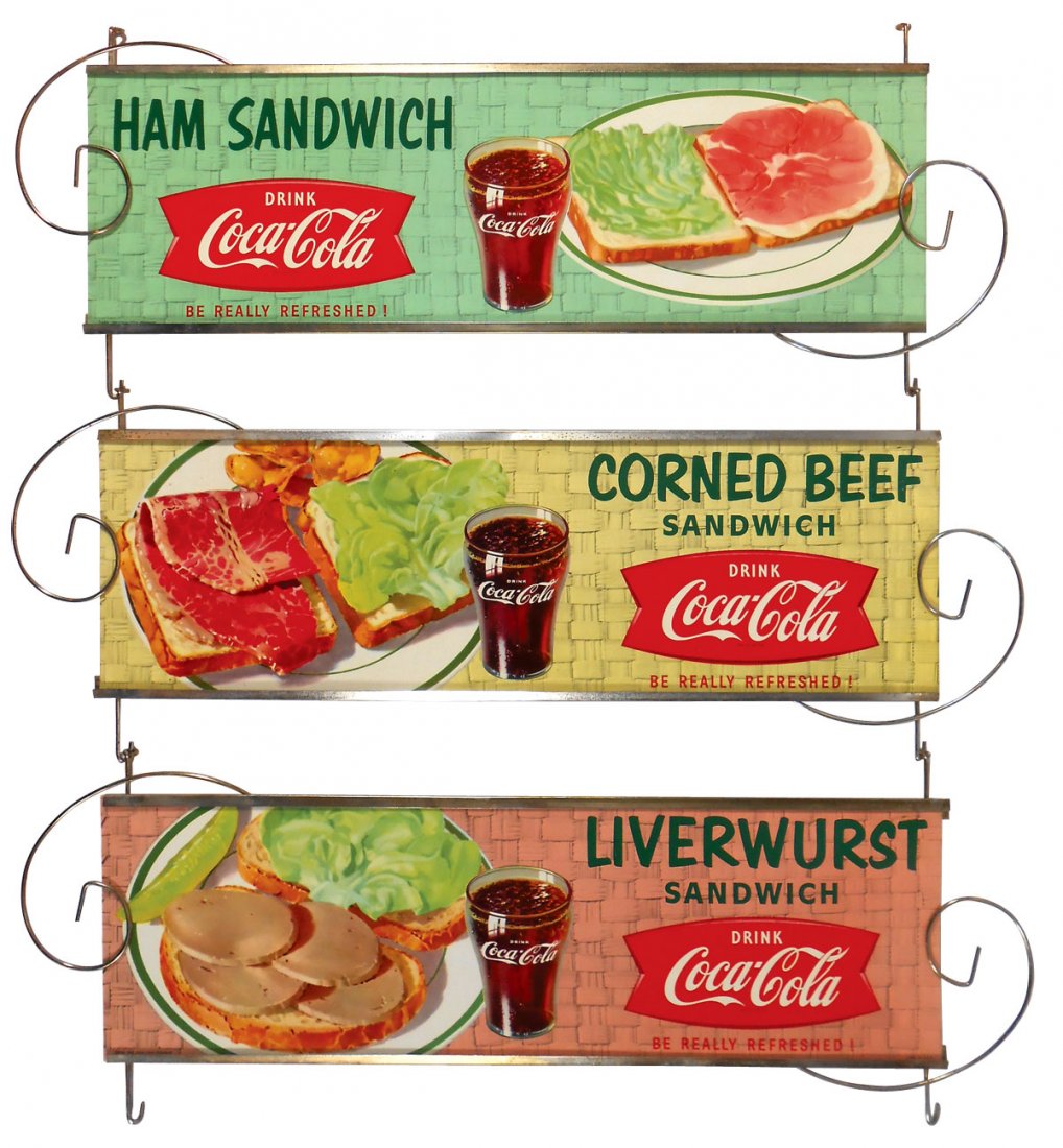 Coca-Cola diner signs (3) Liverwurst Sandwich, Ham: Coca-Cola diner signs (3) Liverwurst Sandwich, Ham Sandwich & Corned Beef Sandwich, colorful cdbd in orig metal frames, Exc cond, 7"H x 22"W.