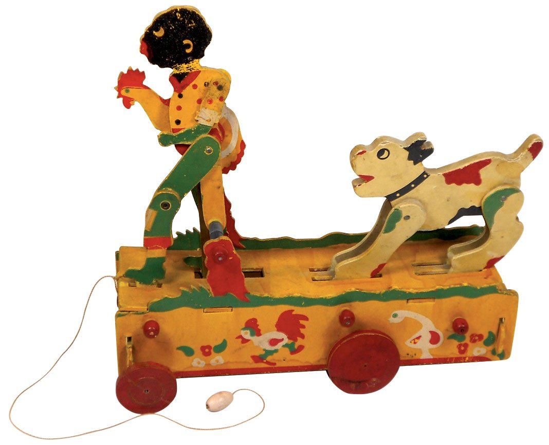 Toy, Black Americana, colorful chicken snatcher: Toy, Black Americana, colorful chicken snatcher w/chasing dog pull toy, paper litho over cdbd, VG wkg cond w/minor paint wear & light stain on bottom edge, 12"H x 12.5"L.