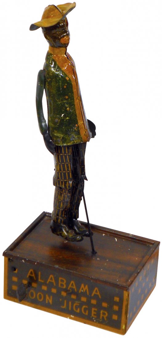 Toy, Black Americana, Tombo Alabama Coon Jigger, litho: Toy, Black Americana, Tombo Alabama Coon Jigger, litho on tin wind-up by Ferdinand Strauss, brown & yellow stage, c.1910, Exc cond w/minor paint wear, 10.5"H x 4.5"W.