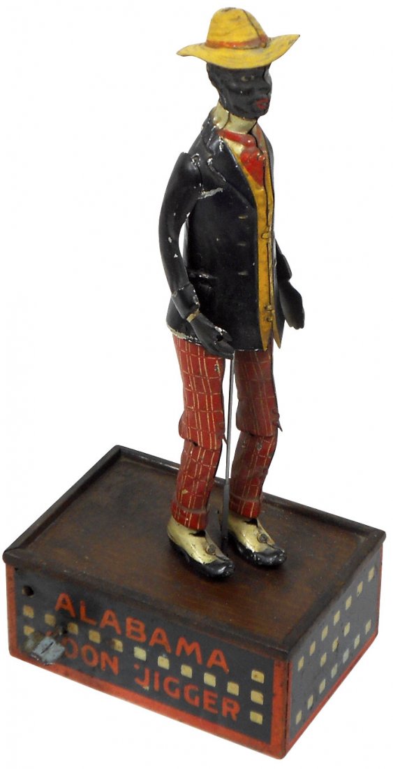 Toy, Black Americana, Tombo Alabama Coon Jigger, litho: Toy, Black Americana, Tombo Alabama Coon Jigger, litho on tin wind-up by Ferdinand Strauss, red & blue stage, c.1910, VG+/Exc cond w/minor paint wear, 10"H x 4.5"W.