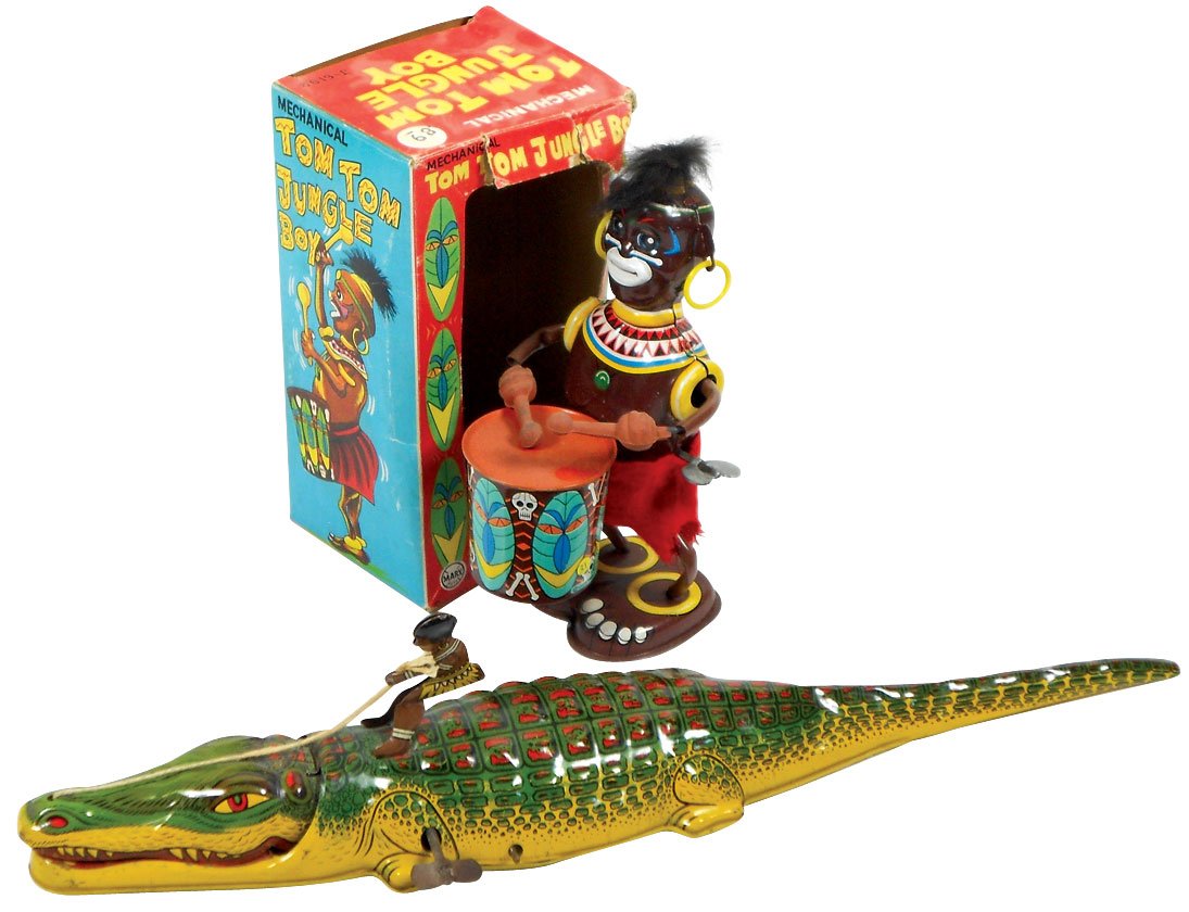 Toys (2), Black Americana, Louis Marx Tom Tom Jungle: Toys (2), Black Americana, Louis Marx Tom Tom Jungle Boy in box & J. Chein alligator w/native aboard, both litho on tin wind-ups in Exc+ cond, box 7"H x 3.5"W.