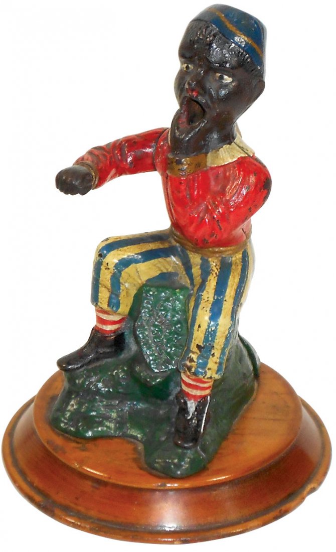 Black Americana, cigar cutter, Black man, cast iron,: Black Americana, cigar cutter, Black man, cast iron, c.1876, VG cond w/minor paint wear & chip on base, 6.5"H x 3"W.