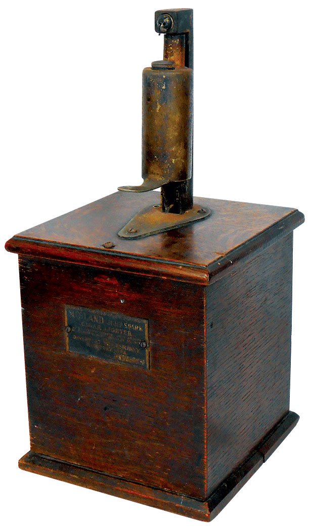Cigar lighter, Midland Jump Spark, Davenport Mfg.: Cigar lighter, Midland Jump Spark, Davenport Mfg. Co.-Davenport, IA, oak case w/orig brass maker's plate, VG cond, 15"H x 7"Sq.