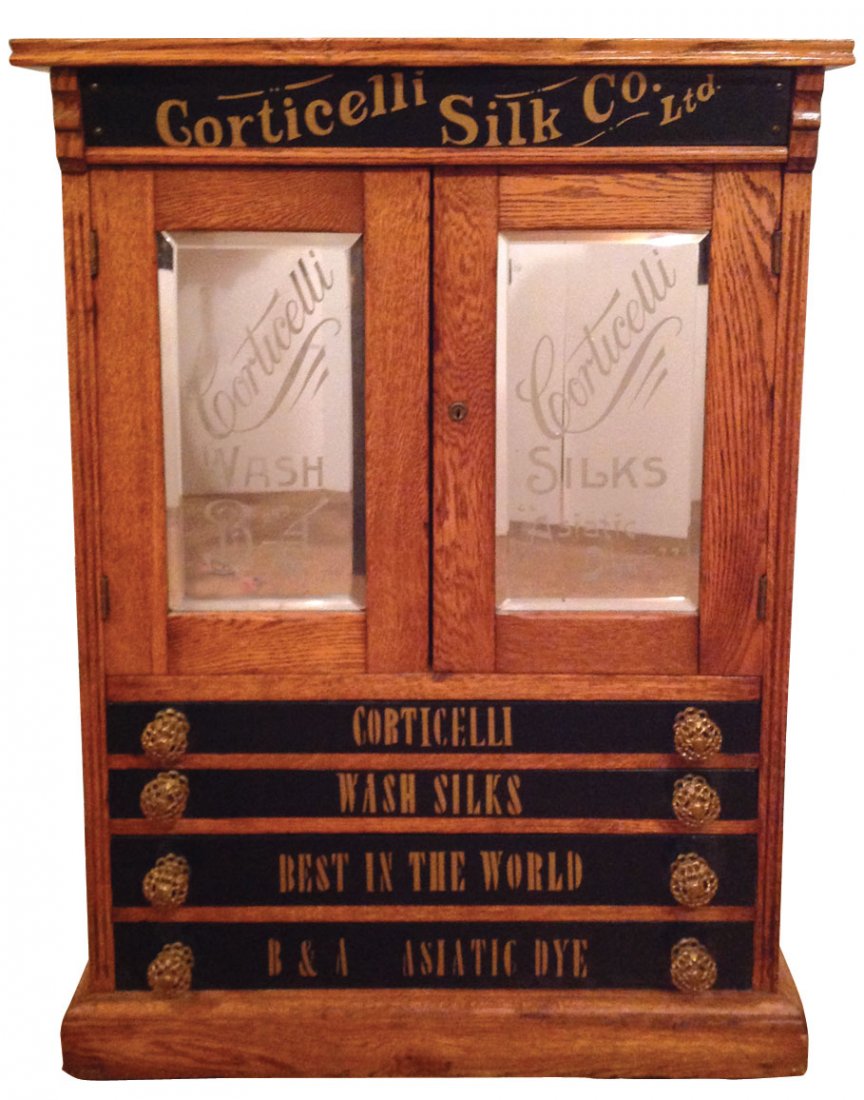 Spool cabinet, Rare Corticelli Silk & Dye, oak w/2: Spool cabinet, Rare Corticelli Silk & Dye, oak w/2 etched mirrored doors & 4 wood drwrs w/advertising, interior has 24 glass drwrs, c.1890's, a highly unusual cabinet w/VG orig finish, 33"H x 24"W x 1