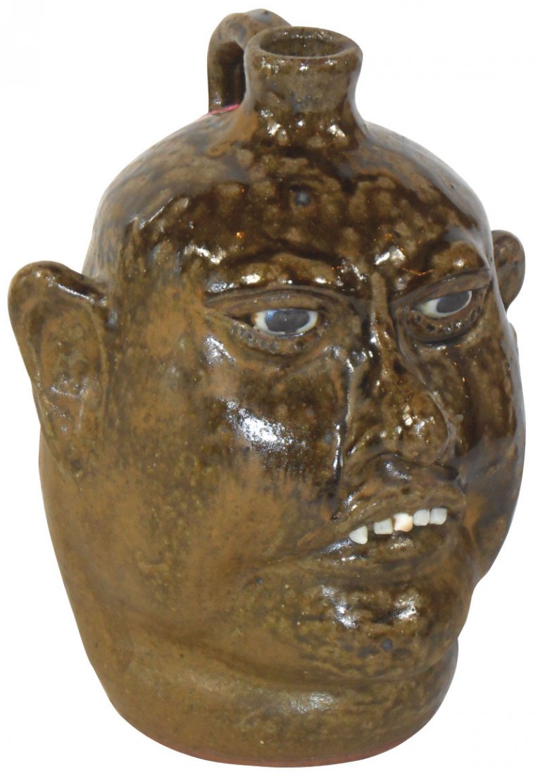 Meaders folk pottery face jug w/grotesque features,: Meaders folk pottery face jug w/grotesque features, Lanier Meaders' signature on bottom, wonderful mottled green glaze, Exc cond, 10.5"H x 8.5"W.