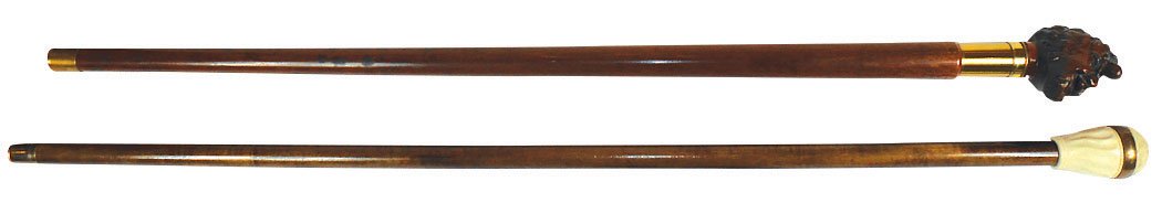 Canes (2), walnut cane w/carved Black man's head, brass: Canes (2), walnut cane w/carved Black man's head, brass telescope inside reads "Pockescope Jr. Wollensak-Rochester, USA & curly maple cane w/stone knob-opens to reveal compass, tagged HC, both Exc con