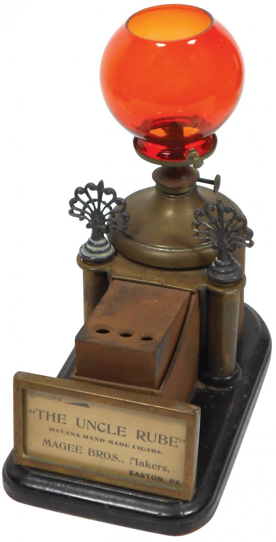 Cigar cutter & lighter, "The Uncle Rube", Magee Bros.: Cigar cutter & lighter, "The Uncle Rube", Magee Bros. Makers-Easton, PA, mfgd by Oneida Specialties-Oneida, NY, red glass globe & 2 wick holders w/fancy finials, Exc cond, 9.5"H x 5"W x 8.5"D.