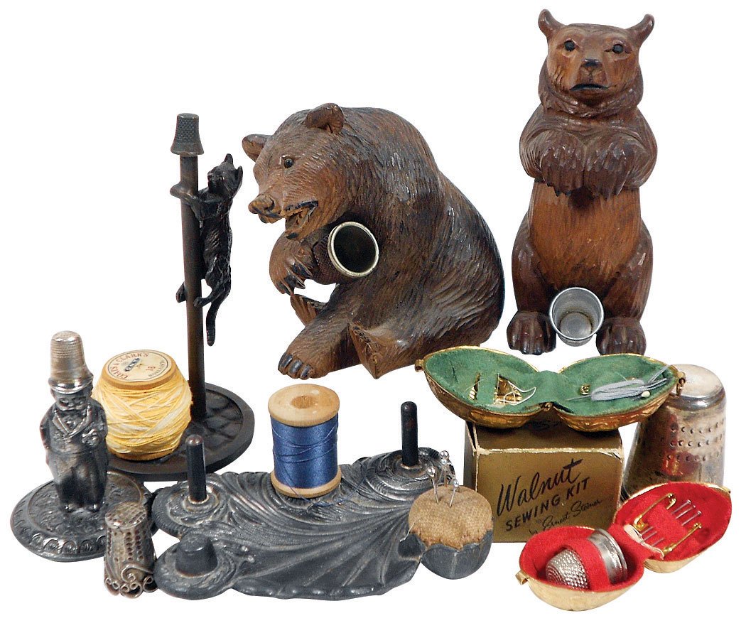 Sewing tools (8), Black Forest carved wood bear thimble: Sewing tools (8), Black Forest carved wood bear thimble holders, metal & walnut sewing kits, thread holders, sterling oversized thimble inscribed "Thimble-Full," VG to Exc cond, up to 4.75"H.