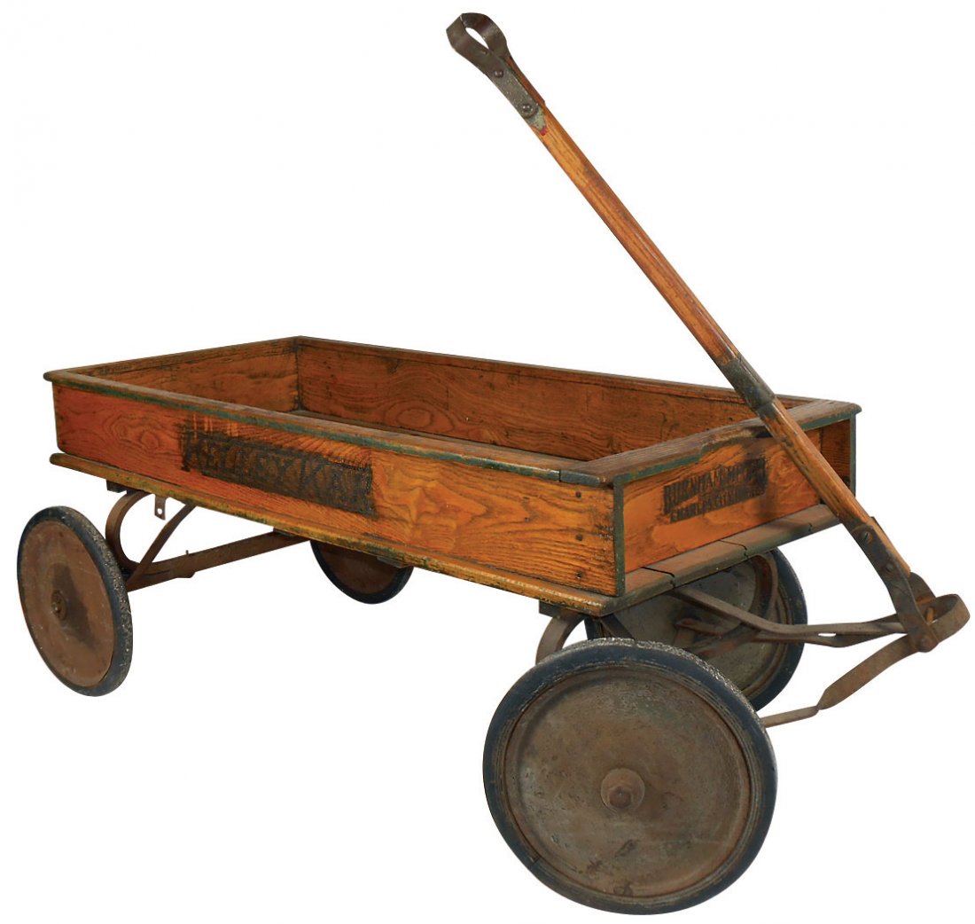 Children's coaster wagon, "Kelley Kar", mfgd by: Children's coaster wagon, "Kelley Kar", mfgd by Barnham-Charles City, IA, wood box w/orig decals, metal wheels, VG orig cond, 18"H x 46"L.