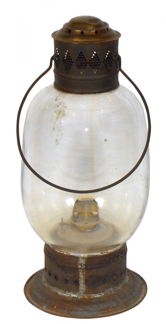 Lighting, early pierced tin w/oil reservoir, mfgd in PA: Lighting, early pierced tin w/oil reservoir, mfgd in PA but maker's name not legible, cutout stars circle base, fancy pierced top, unusual shaped globe, Exc orig cond, 13"H.