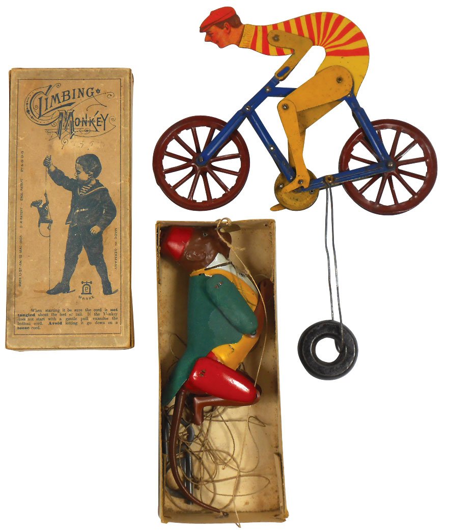 Toys (2), College Boy Bicycle string toy, will race: Toys (2), College Boy Bicycle string toy, will race along on string when lifted, litho on tin by Quadriga Toy Co., Exc cond, 8"L & Climbing Monkey string toy in box, litho on metal, made in Germany & 
