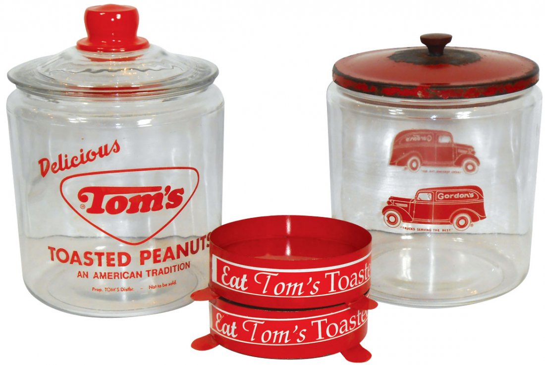 Peanut jars & metal bases (4), Tom's Toasted Peanut: Peanut jars & metal bases (4), Tom's Toasted Peanut glass jar w/lid, (2) Eat Tom's Toasted Peanuts metal bases (for smaller jars) & Gordon's glass jar w/worn metal lid, all Exc unless noted, 2" to 10.