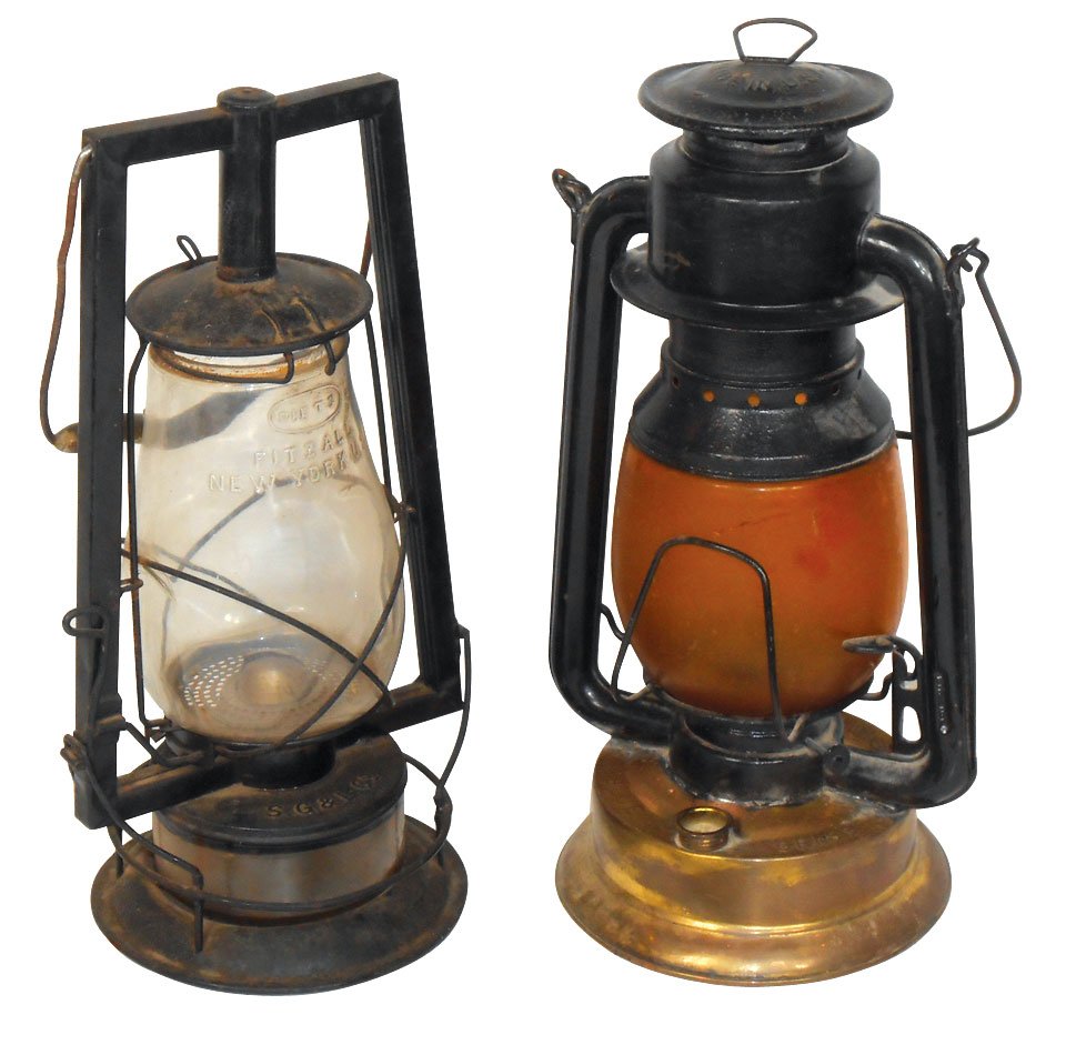 Lighting, lanterns (2), S.G. & L. Co. "Crystal" w/glass: Lighting, lanterns (2), S.G. & L. Co. "Crystal" w/glass base & Belnap Hdwr & Mfg-Louisville "Blue Grass" w/brass base & amber globe, both Exc cond, 14" & 14.5"H excluding handles.