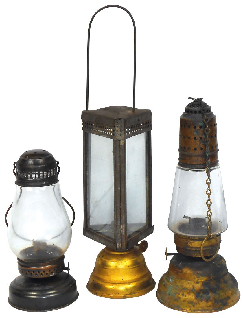 Lighting, skater's lamps (3), one w/angled globe, dated: Lighting, skater's lamps (3), one w/angled globe, dated Apr 1864, all orig w/chain, O.L. & L. Co.-Hamilton lamp w/bulbous globe & 3-sided lamp, Holmes Booth & Haydens-Waterbury, CT, pierced tin w/fixe