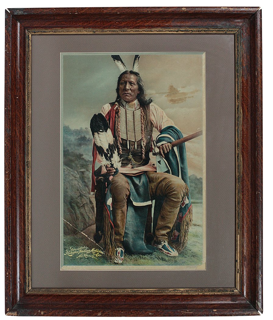 Advertising sign, Kickapoo Indian Medicine Chief Red: Advertising sign, Kickapoo Indian Medicine Chief Red Spear, chromolithograph by J. Ottman, Good/VG cond w/crease at left corner & missing tip of right corner, framed, 26"H x 22"W.