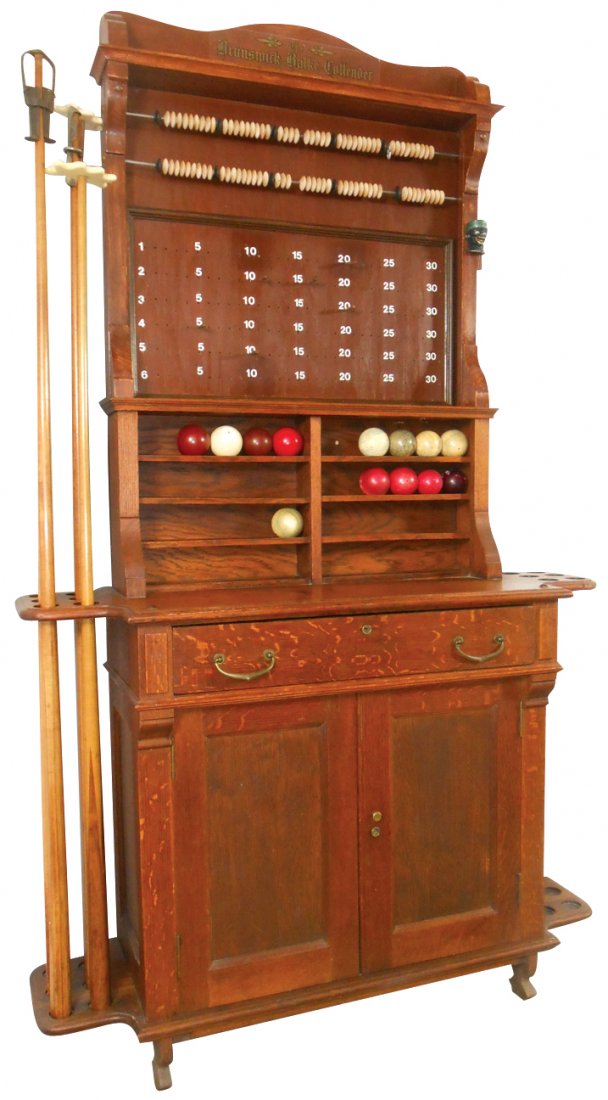 Billiard buffet, Brunswick-Balke-Collender, oak,: Billiard buffet, Brunswick-Balke-Collender, oak, c.1890's, holds cues, balls & chalk, has a drwr & a cupboard for everything else, pea-pool & sliding bead scorekeepers at top, c.1890's, VG/Exc refinis
