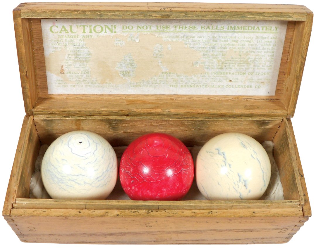 Billiard balls & box (4), 3 ivory 2.25" carom balls in: Billiard balls & box (4), 3 ivory 2.25" carom balls in Brunswick-Balke-Collender dovetailed wood box marked w/"Caution" citation, c.1900, Exc cond w/minor wear, box 3"H x 8.5"W x 3"D.
