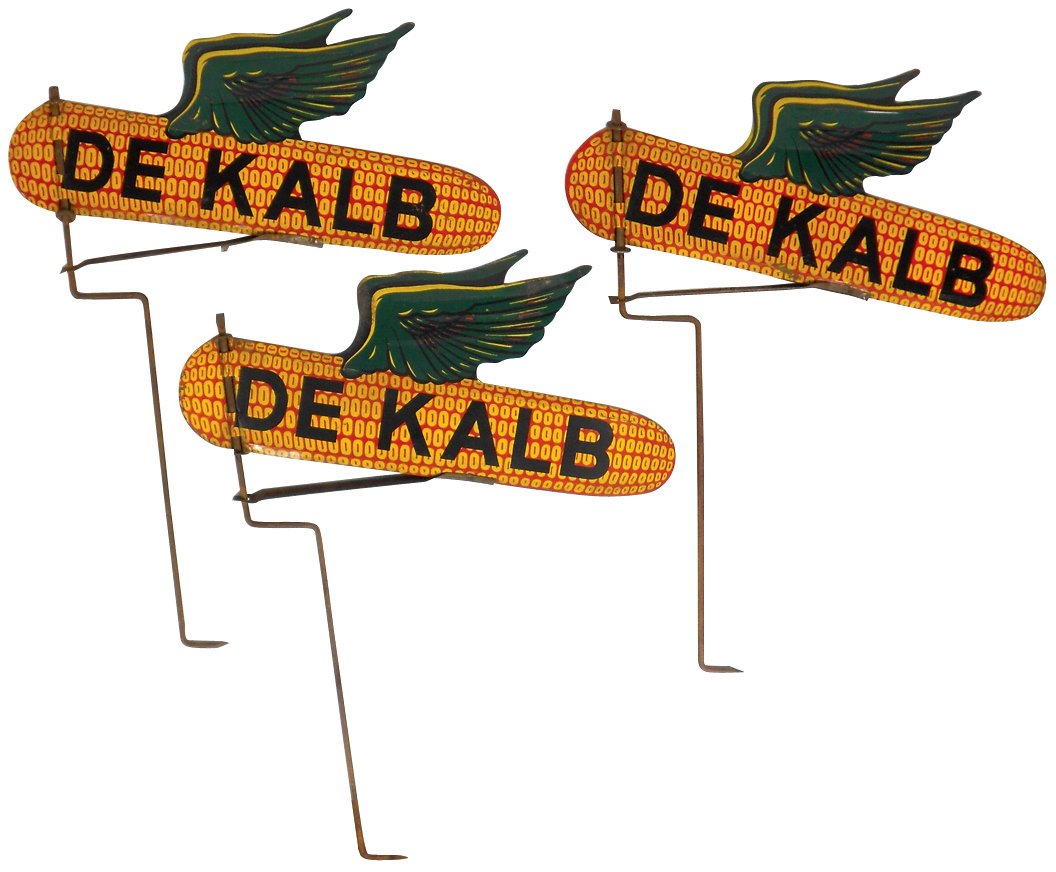 Advertising signs (3), DeKalb Seed Corn, 2-sided litho: Advertising signs (3), DeKalb Seed Corn, 2-sided litho on metal, wind vane style w/spinner rod, VG/Exc cond, 23"H x 18"wide.