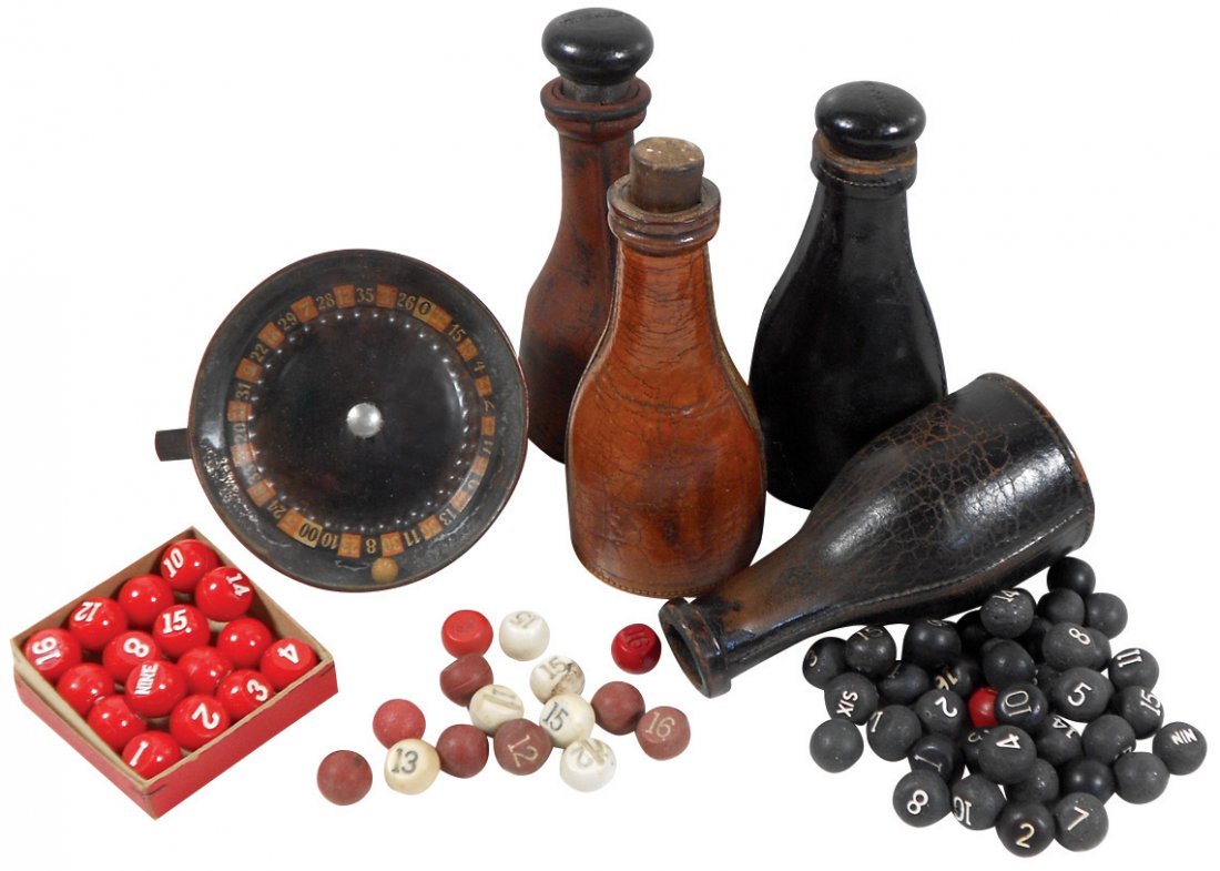 Gambling items, sm metal roulette wheel, VG cond; 4: Gambling items, sm metal roulette wheel, VG cond; 4 leather pea pool shaker bottles (2 marked Brunswick-Balke-Collender) & 4 groups of numbered balls, one in orig box, 1 shaker missing top, o/wise all