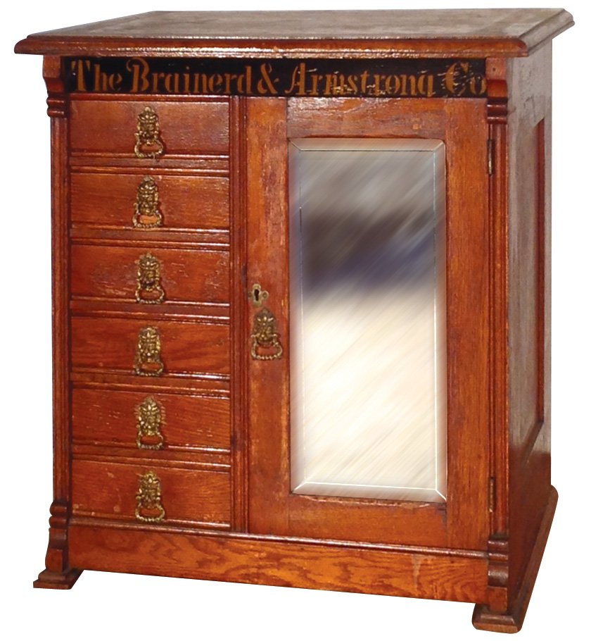 Tailor cabinet, The Brainerd & Armstrong Co., oak w/6: Tailor cabinet, The Brainerd & Armstrong Co., oak w/6 drwrs & door w/beveled mirror, c.1890, Near-Mint orig cond, 23"H x 20"W x 14"D.