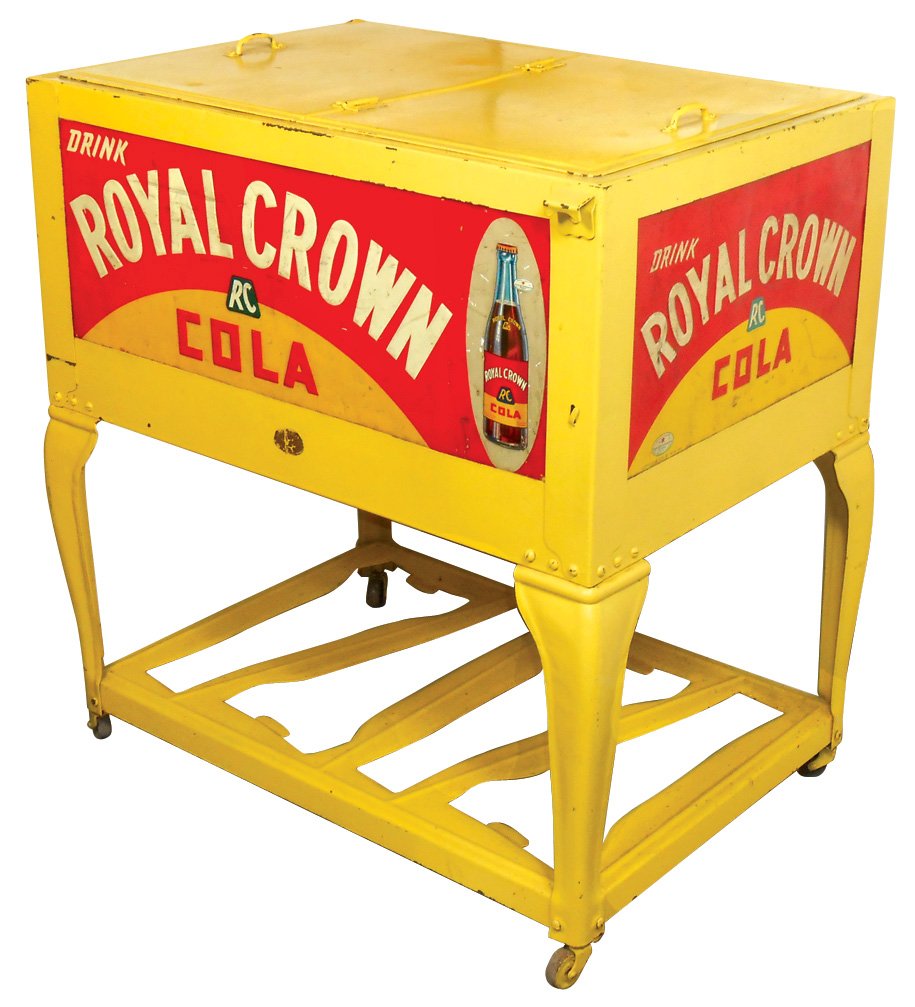 Soda fountain Royal Crown Cola cooler w/lift top, adv: Soda fountain Royal Crown Cola cooler w/lift top, adv panels on all sides, curved legs & cutouts on shelf, VG repainted cond w/no cap catcher, 31"H x 31"W x 22"D.
