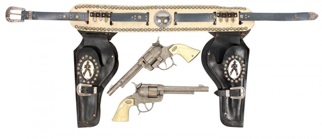 Toy cap guns & holsters, Gene Autry set w/Leslie Henry: Toy cap guns & holsters, Gene Autry set w/Leslie Henry 44 pistols (lgst size), revolving barrels, side loaders & fancy belt/holsters w/toy bullets, Exc cond.