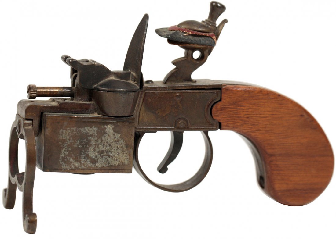 Cigar or cigarette lighter, pistol-shape, mfgd by: Cigar or cigarette lighter, pistol-shape, mfgd by Dunhill, cast metal w/wood handle, hinged cover lifts to reveal flame when trigger is pulled, Exc cond, 4"H x 6"W.