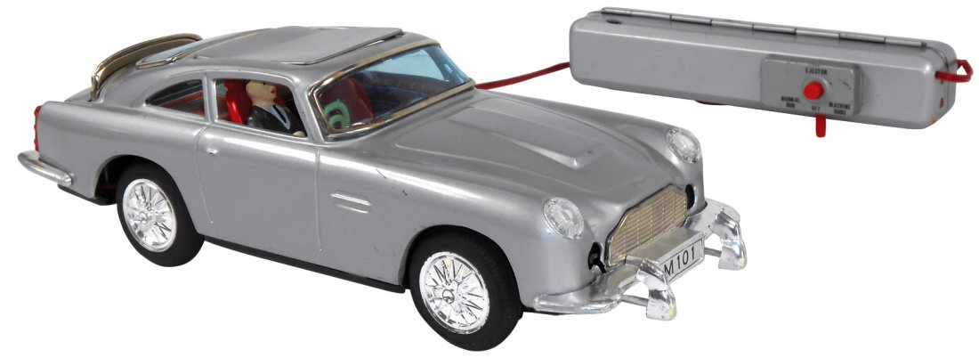 Toy, James Bond Aston Martin DB4, mfgd by Gilbert, tin: Toy, James Bond Aston Martin DB4, mfgd by Gilbert, tin battery-operated remote control car w/ejector seat, machine guns & back shield, Exc cond, 11.5"L.