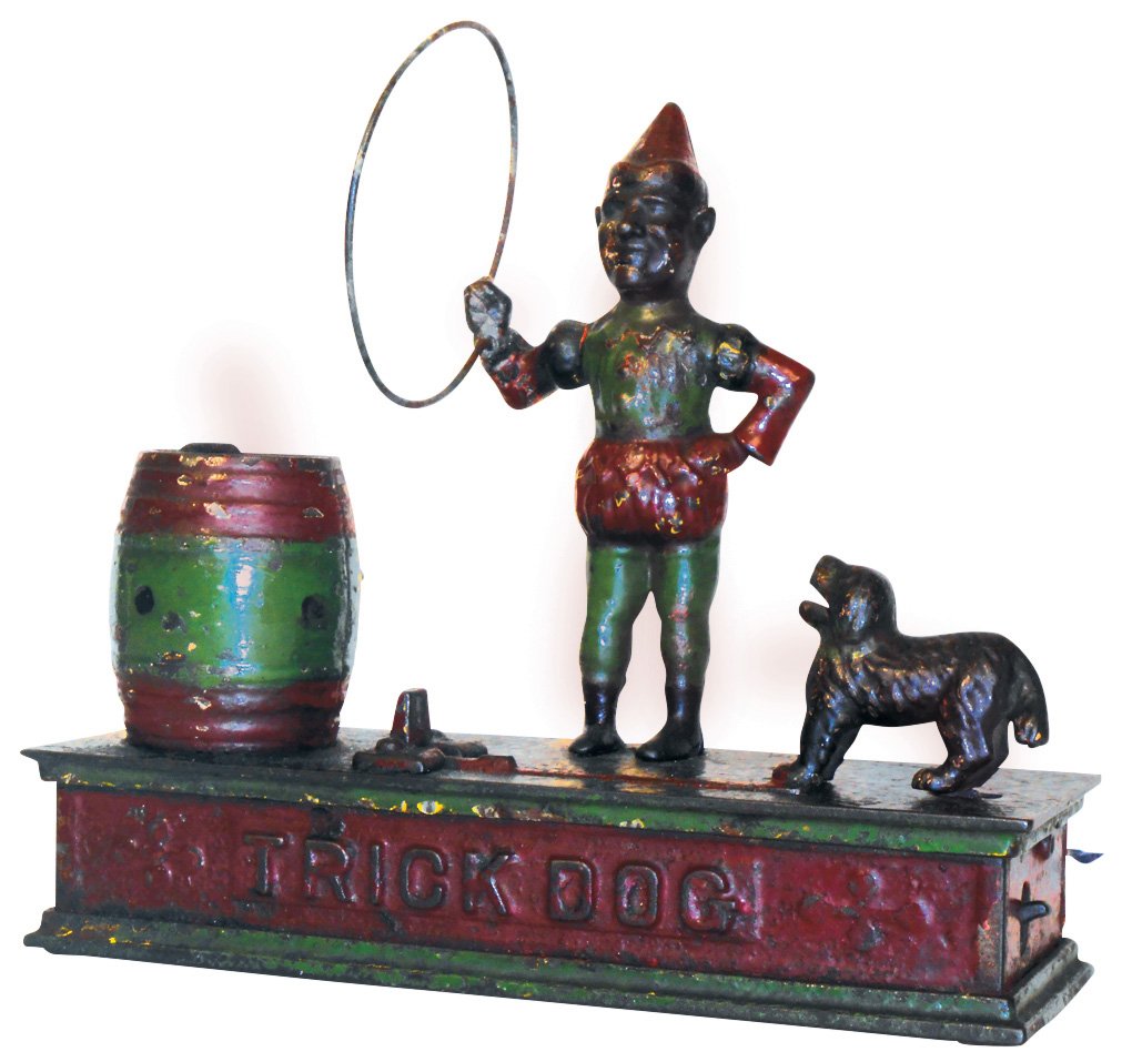 Bank, mechanical, Trick Dog, mfgd by Shepard Hardware: Bank, mechanical, Trick Dog, mfgd by Shepard Hardware Co., designed by Daniel Cooke, patd 1888, cast iron w/orig paint, rectangular trap present, one end of hoop needs to be attached, VG+ cond, 7.5"H 