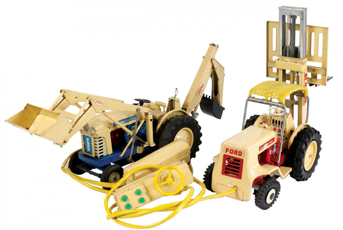 Toys (2), Cragstan Ford forklift & front loader/backhoe: Toys (2), Cragstan Ford forklift & front loader/backhoe combos, tin battery-operated remote control, Exc working cond w/minor paint wear, 20"L.